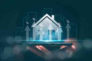 Hologramm eines Hauses auf einer Hand